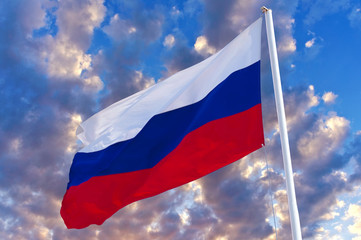 Russian flag waving in the wind over blue sky