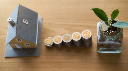 Saving money to invest in house or property in the future. Business Finance Concept.