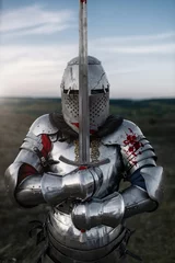 Foto op Plexiglas Knight in armor and helmet poses with sword © Nomad_Soul