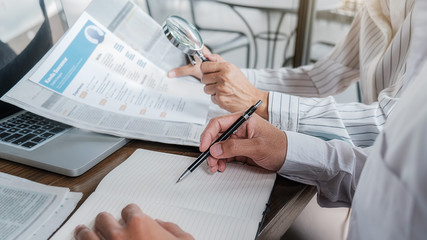 Young unemployed is searching for a job in the newspaper and laptop. Interview the job and hiring...