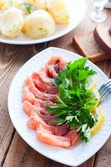 Homemade red salted fish on a white bowl, selective focus