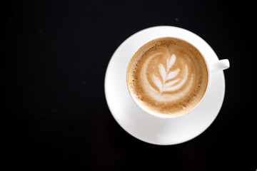 Cappuccino ith coffee art on foam. Cup of Cappuccino Coffee with milk. Barista coffee style