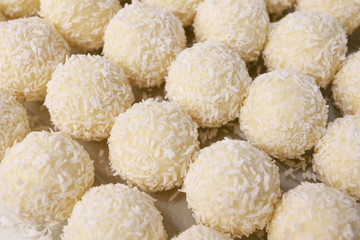 Round sweets with coconut. Raw handmade candy, healthy dessert.