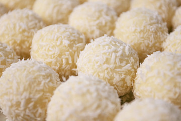 Round sweets with coconut. Raw handmade candy, healthy dessert.