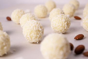 Round sweets with coconut. Raw handmade candy, healthy dessert.