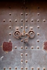 A medieval steel door that has been bolted shut.  Access denied concept image. 