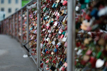 Closeup of love lockers at famous bridge Makartsteg in Salzburg, Austria. Padlocks of love on a bridge.
