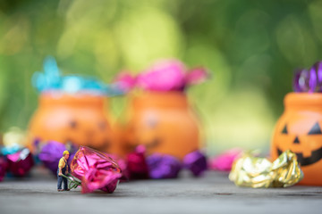 Halloween jack-o-lantern pail with spilling candy