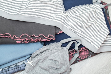 women's clothing, folded underwear, a bra and pajamas of cotton, clean clothes folded a few times