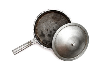 Old cast iron frying pan isolated on white