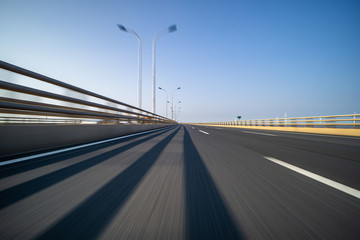 Obraz na płótnie Canvas high speed view of asphalt road