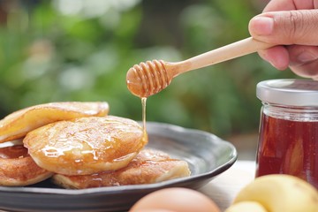 Pancakes served honey on table, healthy breakfast for everyday. Clean food good taste for advertising ideas concept. 