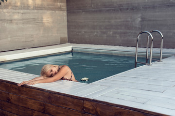 Young blonde in summer open studio