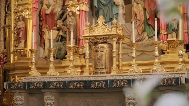 Catholic Church Tabernacle with Blurred Flowers in Foreground