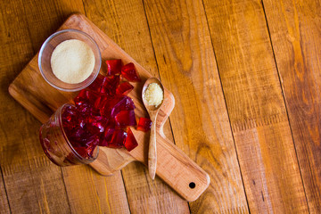 Gelatin powder and jelly on background