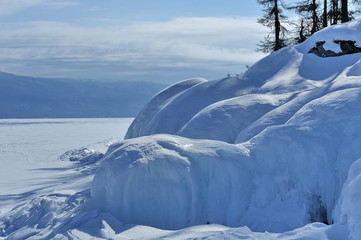 Winter on Lake Baikal. The huge blocks of stone were frozen as a result of the freezing of the washing waves.