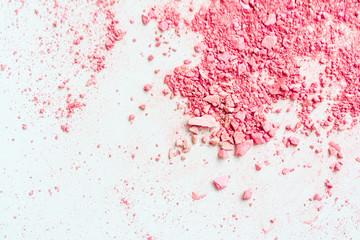Fototapeta premium Smear of crushed pink blush on as sample of cosmetics product, copy space, top view.