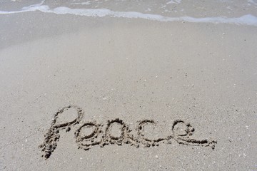 Vertical Background with peace written in the sand