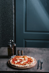 Delicious Pizza served on a cutting board