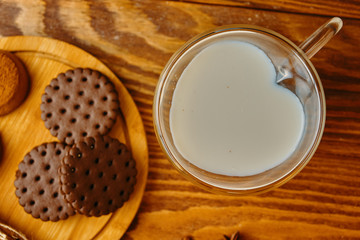 Milk and cookie on the table. Cookies and milk with autumn decor. Top view