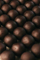 Round chocolates candy. Dark background, luxury dessert, dark chocolate, handmade.