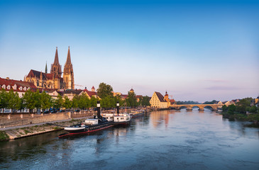 Fototapeta premium Regensburg cityscape with Danube river embankment St. Peters Cathedral and Stone Bridge Bavaria Germany