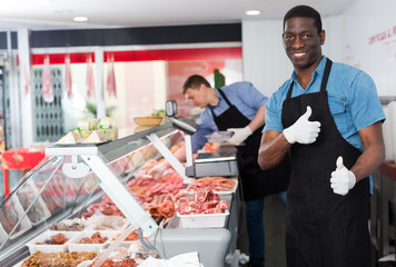 Fototapeta na wymiar Satisfied African American butcher