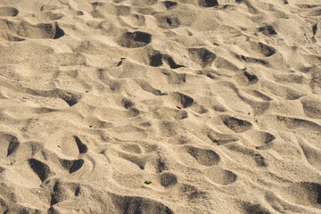 Footprints in the beach sand background