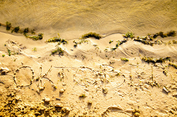 inscription october on the sand at the beach autumn
