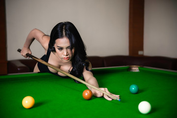 Portrait of asian sexy woman wear black one piece at snooker club,Beautiful Thailand people pose for take a picture