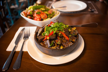 Georgia. Tomato and cucumber salad with nuts and meat