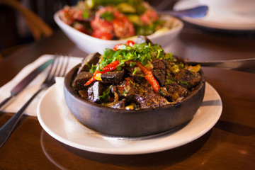 Georgia. Tomato and cucumber salad with nuts and meat