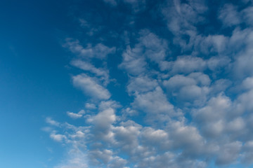 Naklejka na ściany i meble Blue sky with clouds as background, copy space, texture