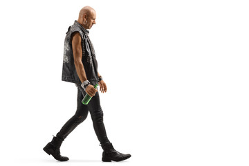 Punker walking and holding a bottle of beer