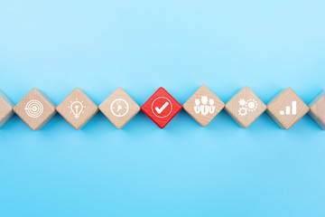Action plan and Business process management concept, wooden blocks with business strategy icons on...