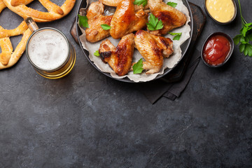 Hot chicken wings and draft beer