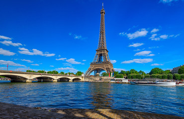 Fototapeta na wymiar Paris Eiffel Tower and river Seine in Paris, France. Eiffel Tower is one of the most iconic landmarks of Paris. Cityscape of Paris