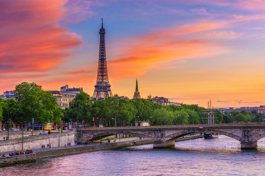 Sunset view of Eiffel tower and Seine river in Paris, France. Eiffel Tower is one of the most iconic landmarks of Paris. Cityscape of Paris