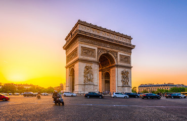 Paris Arc de Triomphe (Triumphal Arch) in Chaps Elysees at sunset, Paris, France.