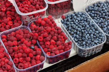 Boxes with blackberry and raspberry from farmers market. Vitamin healthy food ready to eat