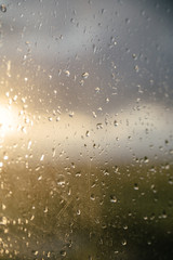 drops of water on windows glass and sun