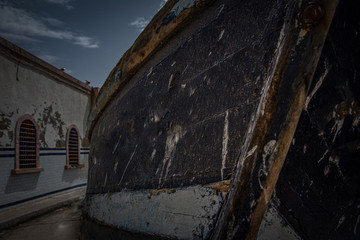 Close up view of the front of an old traditional wooden blue fisherman boat. Essaouira, Morocco