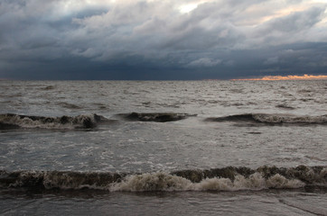 Large waves of sea and dark clouds