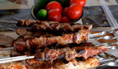 freshly grilled pork skewers and vegetables