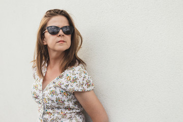 Woman leaning against wall