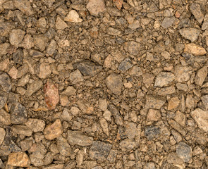 Vue gros plan d'une texture de pierre et gravier marron humide