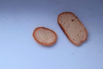Pieces of bread on the table. Close-up view