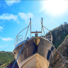 yacht installed on the platforms on the shore out of season. Boats parked on land.