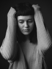 Worried sad young woman. Black and white.