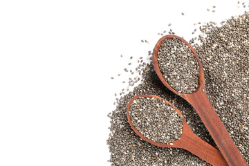 Chia seeds and wooden spoons isolated on white background